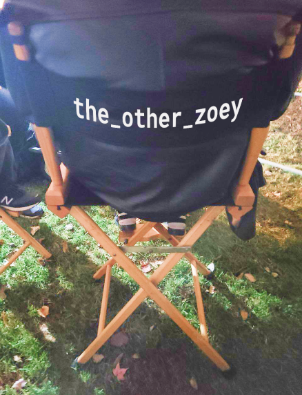 The Other Zoey director chair in use